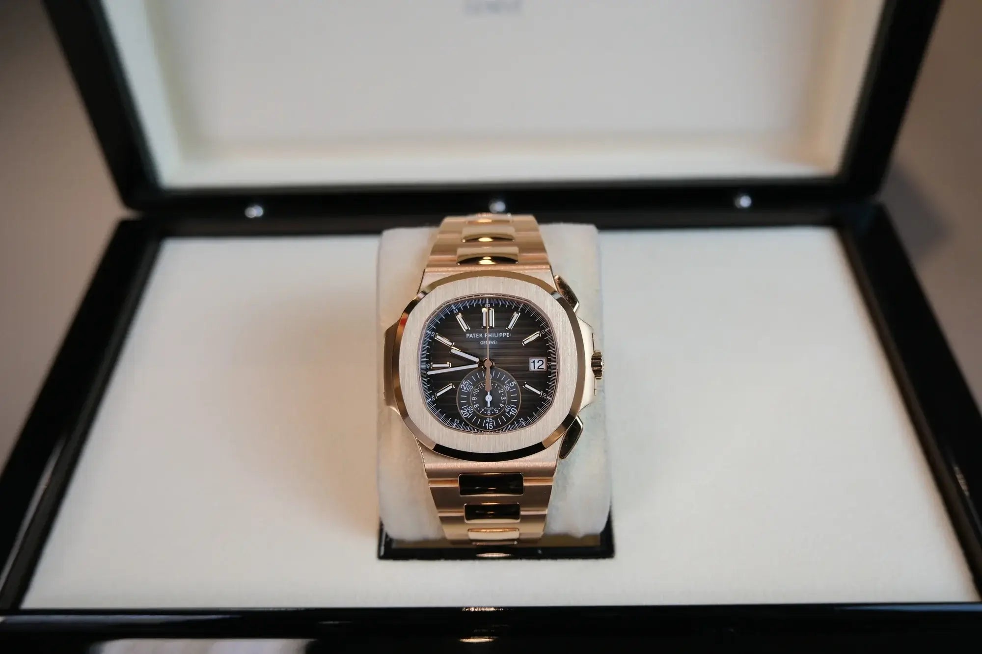 Rose gold watch in a display case