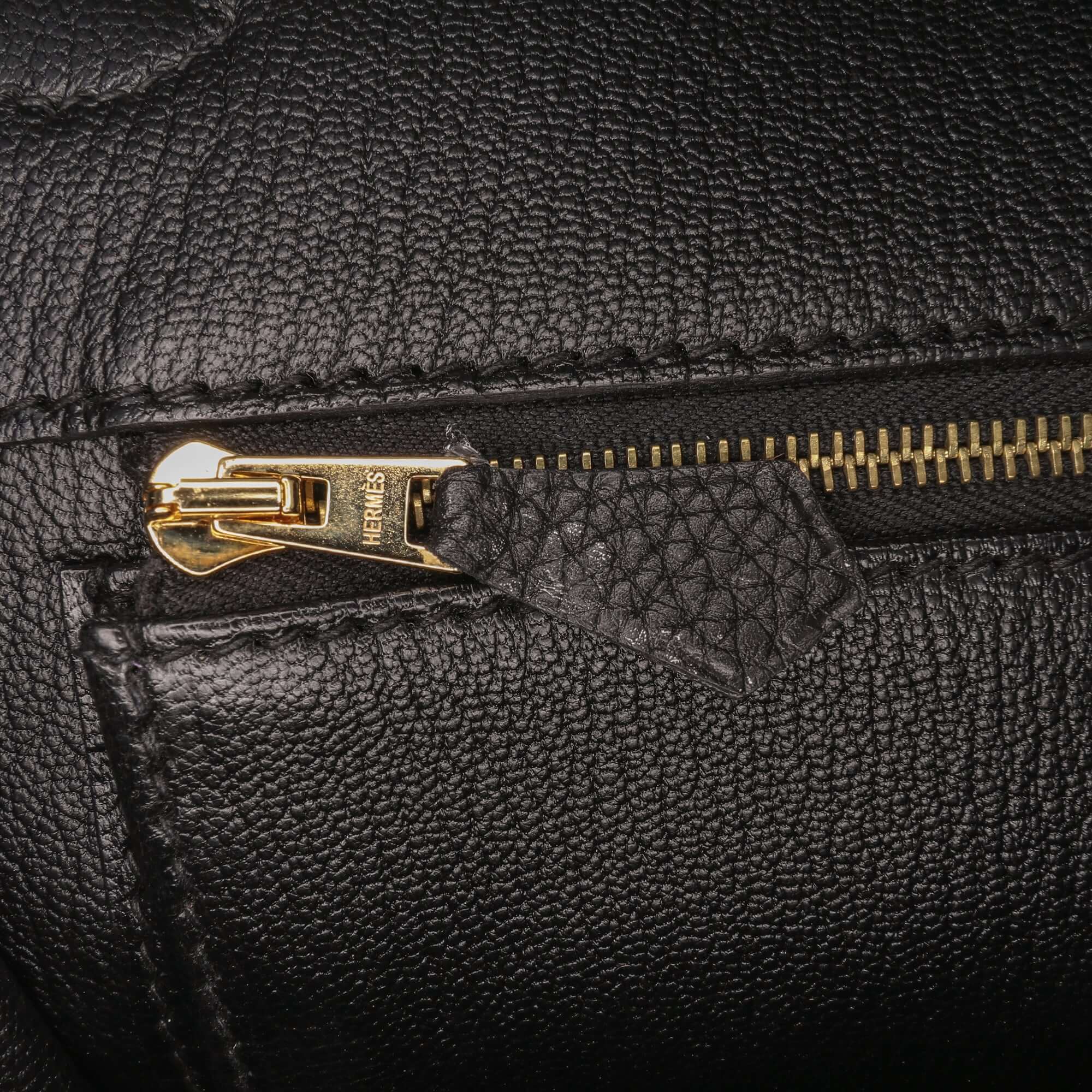 close up image of the internal zip of an Pre-loved Hermès Birkin 35 Black Togo Leather Handbag from 2012 with Lock Set
