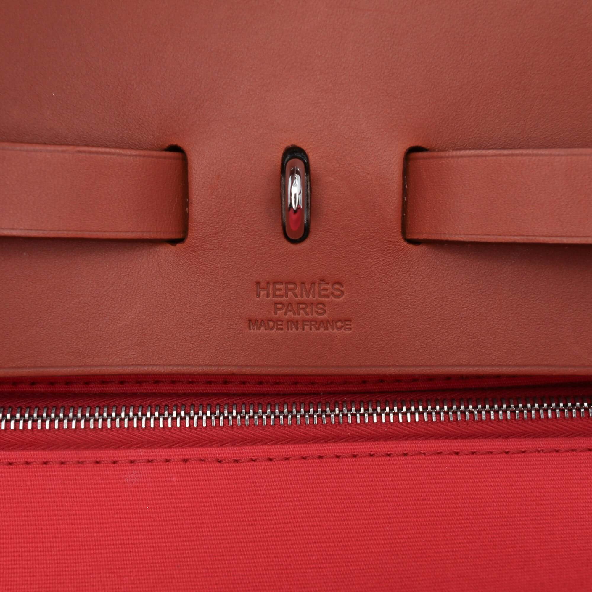 close up view of a Pre-loved Hermès Herbag Zip 39 in pink canvas with leather trim and detachable pouch
