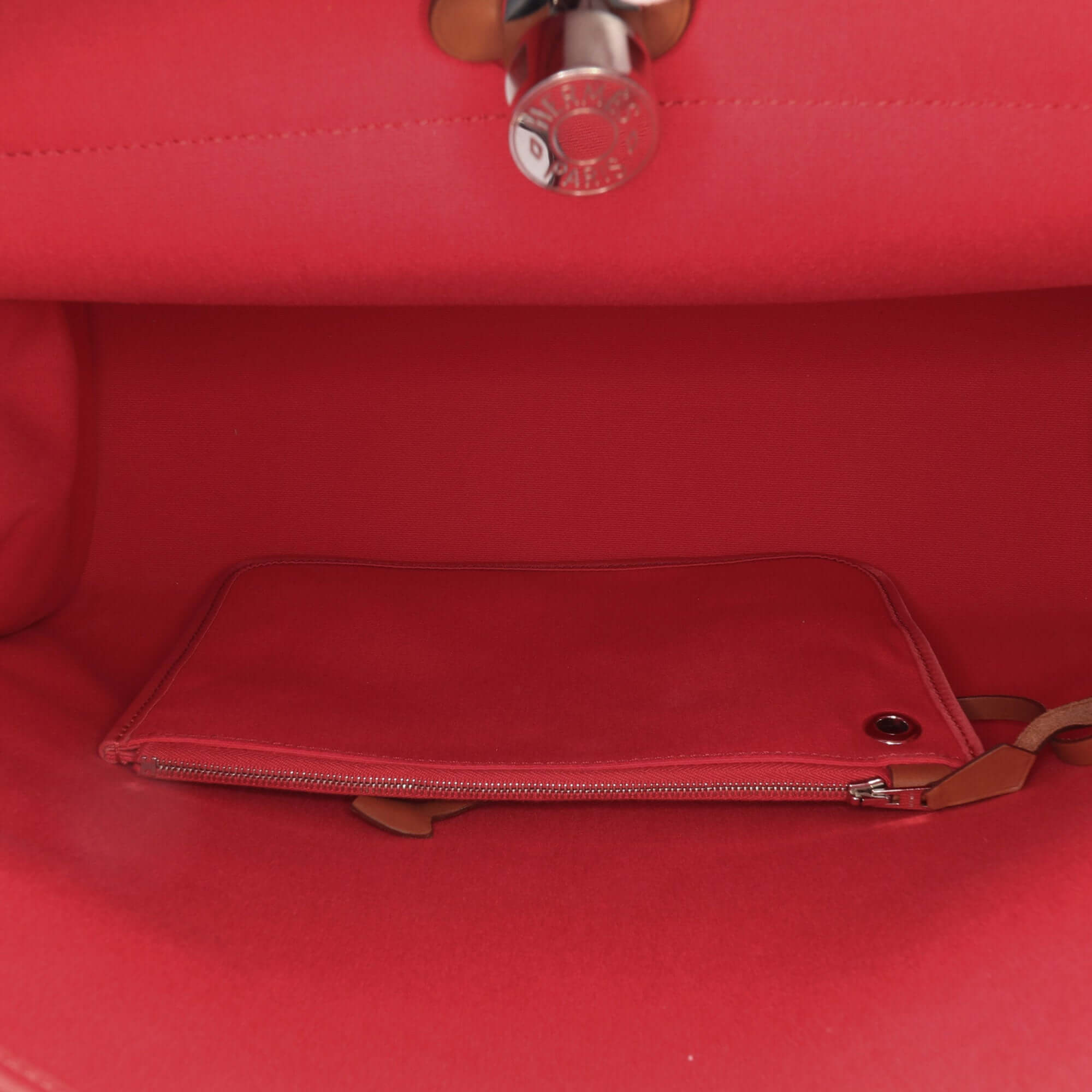interior view of a Pre-loved Hermès Herbag Zip 39 in pink canvas with leather trim and detachable pouch