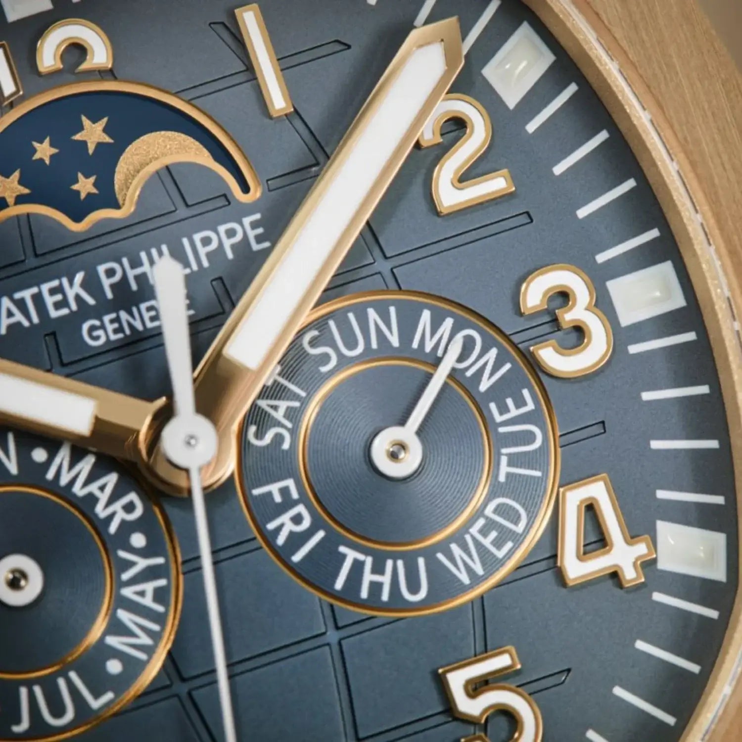 Close-up of a luxury watch face with gold and white details