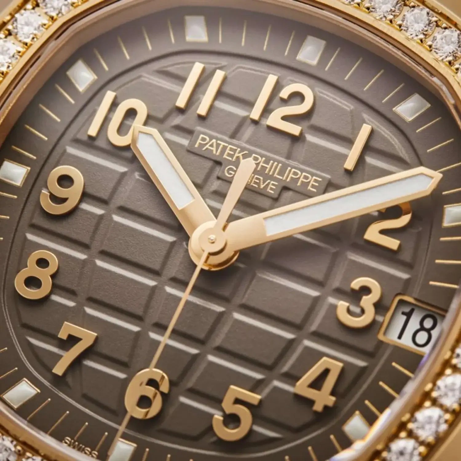 close up view New Patek Philippe Aquanaut Luce 5268/200R-010 in rose gold with taupe dial and diamond-set bezel
