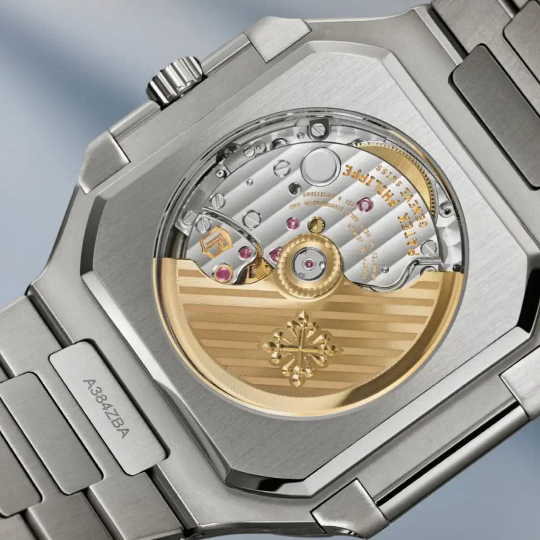 Close-up of a luxury watch with visible brand logo on a blurred background