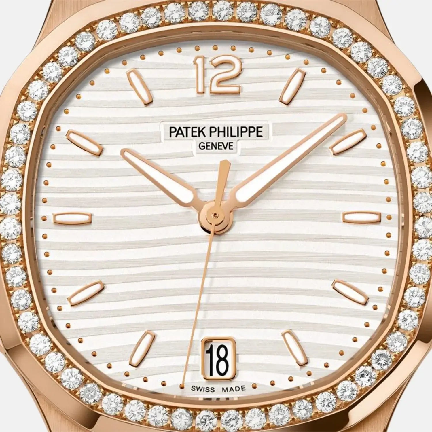 Patek Philippe watch with rose gold case and diamond bezel on a white background