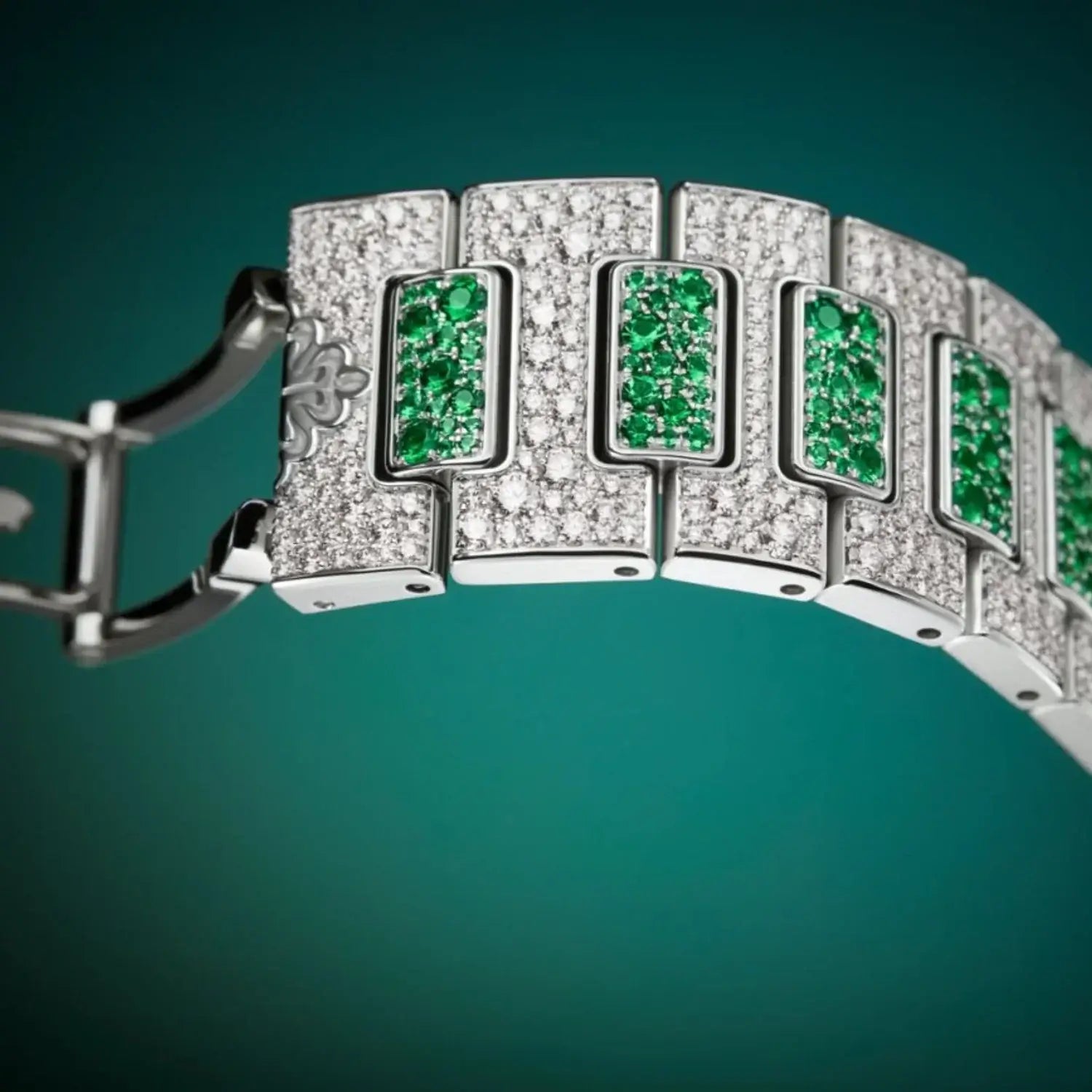 close up view of a New Patek Philippe Nautilus 7118/1453G-001 with full emerald and diamond pavé in white gold
